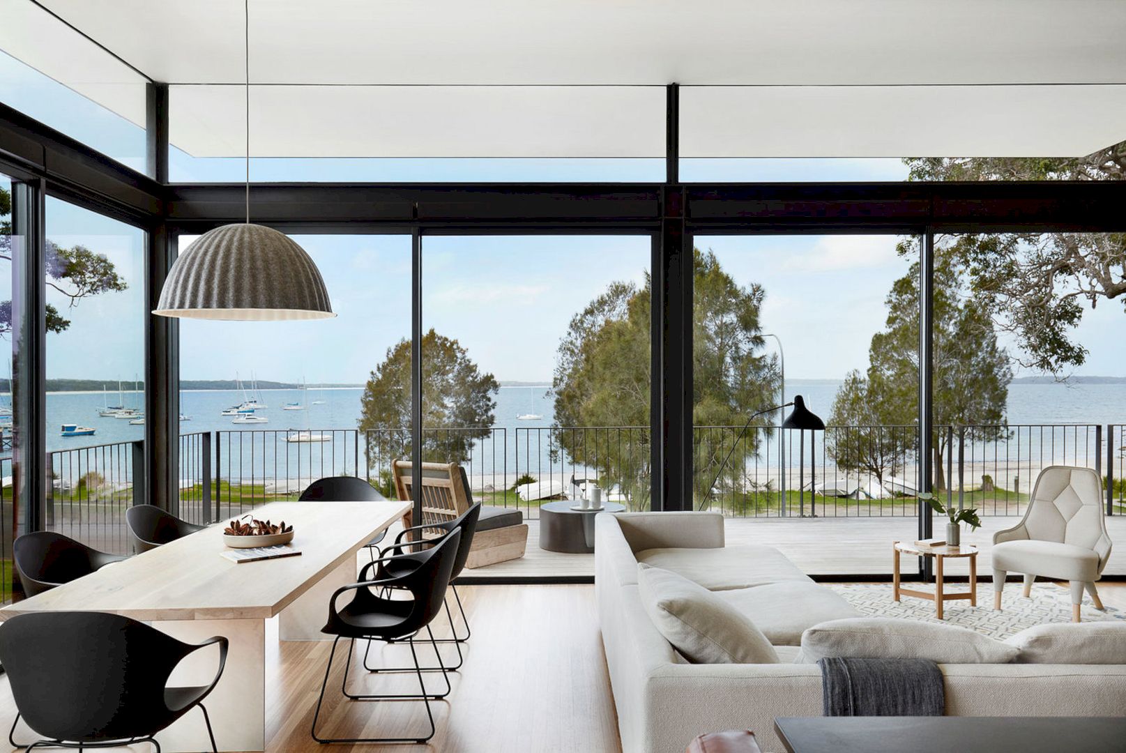Bay House: A Glazed Steel Frame Pavilion with Maximum Transparency